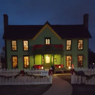 This is the farmhouse at sunset. Green is the original color of the home.