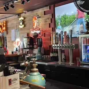 a view of a bar with beer taps