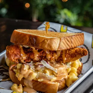 a fried chicken sandwich with macaroni and cheese