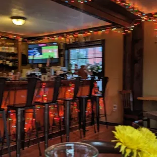 a view of a bar with a bunch of chairs