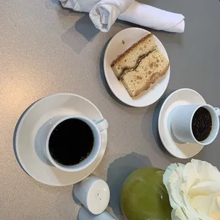 a cup of coffee and a slice of cake