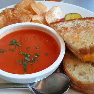 Grilled cheese + tomato soup w/potato chips, butter pickles, and onions.