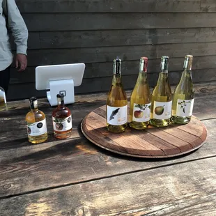 a wooden table with bottles of wine on it