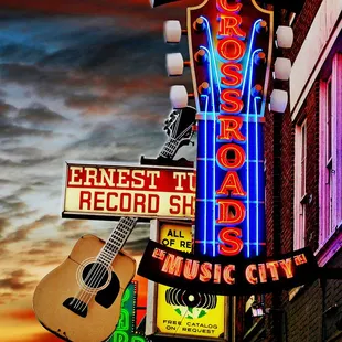 a neon sign for nashville records and music city