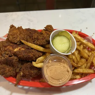 Spicy chicken tenders basket with an extra chicken strip