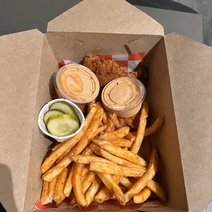 a box of fries and pickles