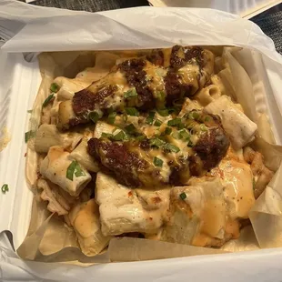 nash mac fries   mac n cheese, nashville hot chicken fritters drizzled with nashville ranch and nash d sauces