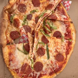 Delivered Luke warm folded in on itself like the delivery person carried it on its side. Dough slightly under cooked