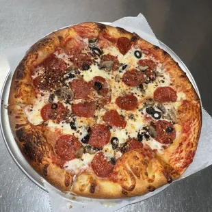 a pepperoni and olive pizza