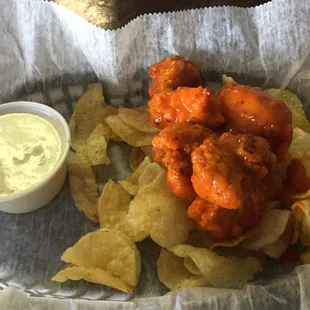 Baked boneless wings on a bed of crunchy kettle-cooked potato chips...delicious!