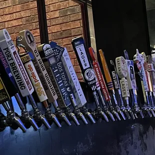 a row of beer taps