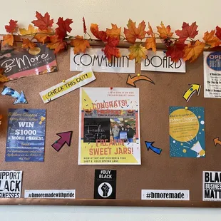a bulletin board decorated with fall leaves