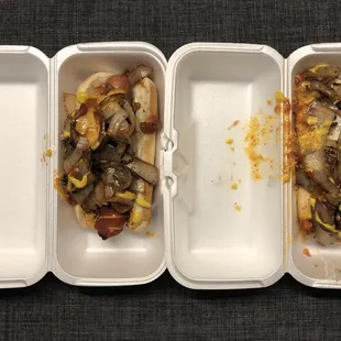 hree hot dogs in a styrofoam container