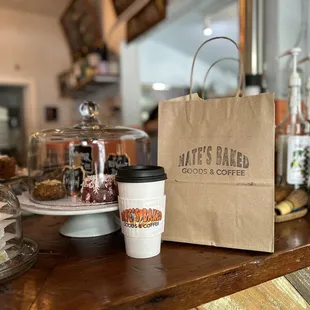 a bag of coffee and a cup of coffee