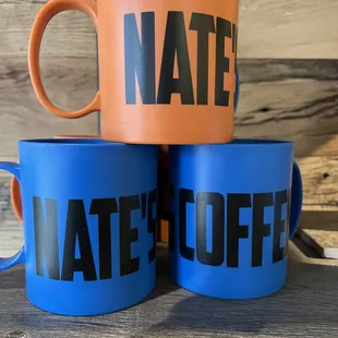 three coffee mugs stacked on top of each other