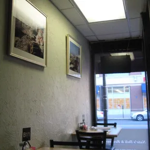 There are a few two tops on each side of the entry and the street view was enjoyable.