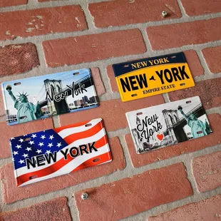 a brick wall with stickers on it