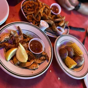1/2 shrimp boil, corn and potatoes  Ribeye steak and shrimp, side of sweet potato fries