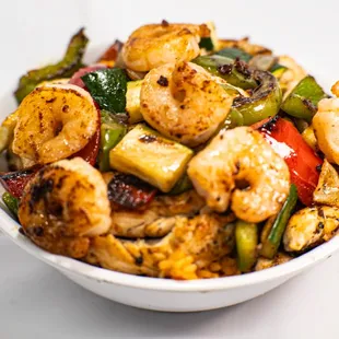 Grilled Shrimp &amp; Chicken over Spanish rice with Mixed Vegetables