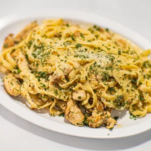 Homemade Fettuccine Alfredo with Grilled Chicken and Alfredo Cream Sauce.