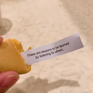 someone holding a fortune card