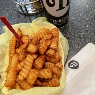 a basket of fried tater tots and a cup of coffee