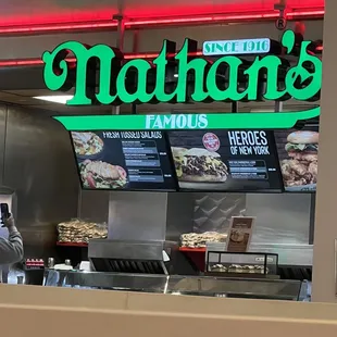 a man standing in front of a restaurant