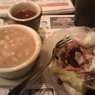 a bowl of soup and a plate of salad