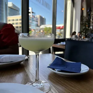 a glass of margarita on a table