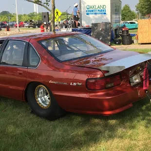 the rear end of a red car