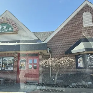Parking in the back and the entrance to Jimmy&apos;s Tavern.