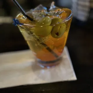 Whiskey Old Fashioned Press with Olives.