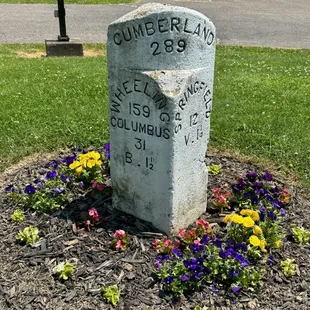 Mile marker from the National Road showing the distance to various cities.