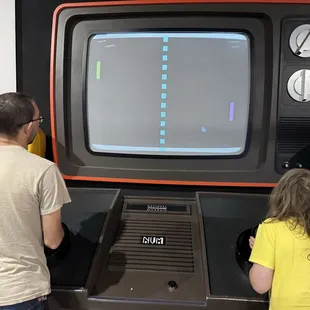 A giant screen in which to play the video game Pong at the National Video Game Museum.