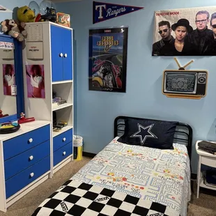 A mock up of a what a teenager's bedroom might look like in the 1990s.