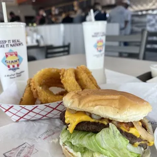 Cheeseburger with grilled onions and onion rings