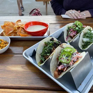 a tray of tacos and chips