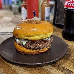 a beef sandwich with cheese on a bun