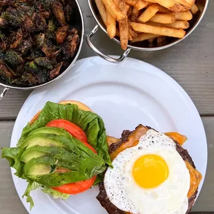 The Sunrise Burger w/ cheddar, egg, avo ($12.75 + extra patty $4.50 + missing bacon $4.75) + Fried Brussels Sprouts ($6.95) + Fries ($3.75)
