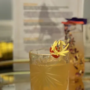 Check out the dried florals adorning the cocktail glass in the back!