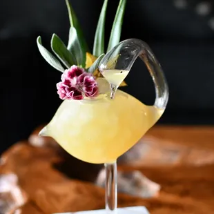 a bird with a flower on its head