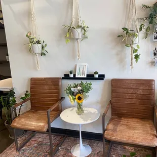 two chairs and a table in a living room
