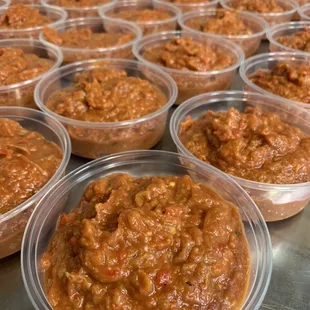 rows of plastic bowls of food