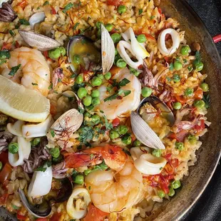 Sea Food Paella made with Arborio Rice cooked in Stewed Tomatoes, Safrron and served with Clams, Bay Scallops, Shrimp, and Calamari *Dinner*