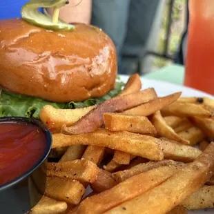 a burger and fries on a plate