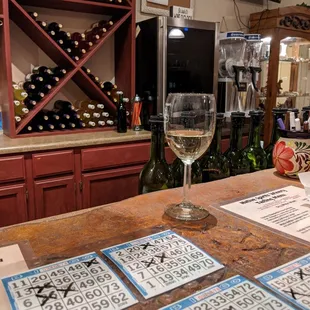 a glass of wine on a bar