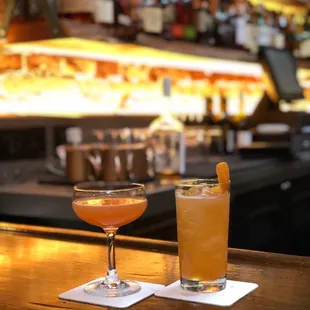 two cocktails on a bar