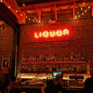 a woman sitting at a bar