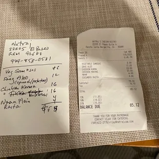 Receipt and Yelp note. Vegetable Samosas Saag Aloo Chicken Korma Chicken Makhani Naan** Cucumber Raita