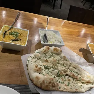 Garlic naan, yellow dal, and Chicken Madras